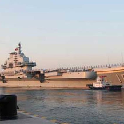 China's first aircraft carrier the Liaoning prepares to set off at dawn yesterday for training exercises in the South China Sea. Photo: Xinhua