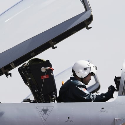 A pilot sits in the cockpit of a Jian-10 fighter jet at Yangcun Air Force base on the outskirts of Tianjin municipality. Photo: Reuters