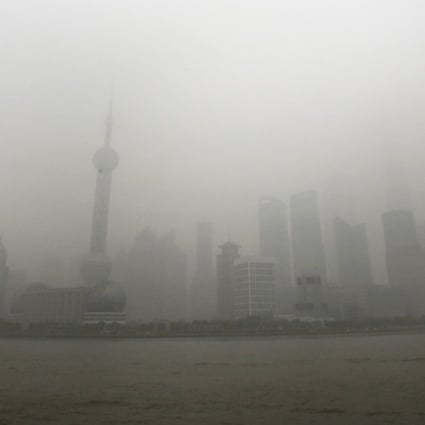 The skyline of the Lujiazui Financial District with the high-rise buildings is covered with heavy smog in Pudong in Shanghai. Photo: AP