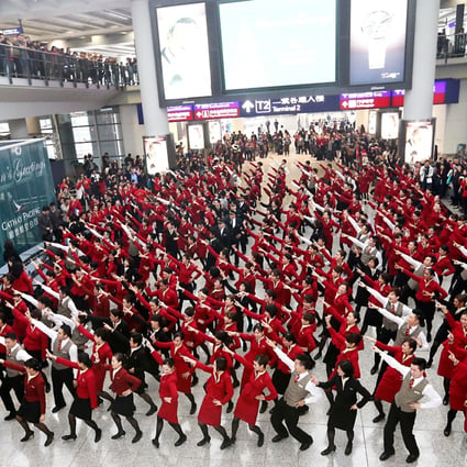 After two weeks of rehearsals, Cathay Pacific crew members give an impromptu dance performance at the arrivals hall of Chek Lap Kok airport. Photo K.Y. Cheng