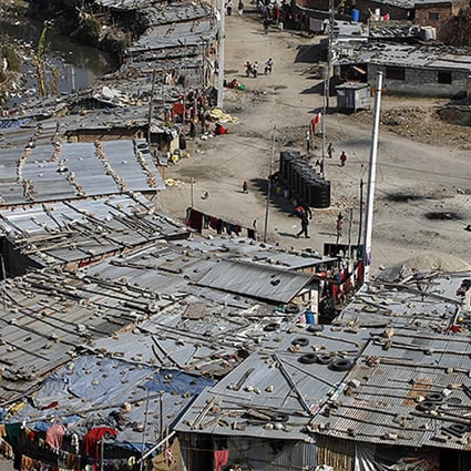 Shabby tin-roofed huts house more than 10,000 people along the banks of the Bagmati river in Kathmandu. Photo: AFP
