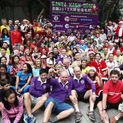 Hash runners are keen to get going as they gather before the start of the Operation Santa Claus Santa Hash 2013 at Lockhart Road playground in Wan Chai. Photo: Jonathan Wong