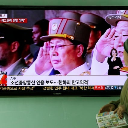 A TV news showing North Korean politician Jang Song-Thaek saluting in Seoul, South Korea. Photo: EPA