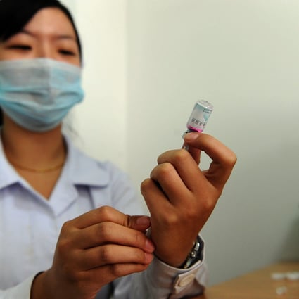A nurse prepares a vaccine, covered under one of China's immunisation programmes this year. Photo: AFP
