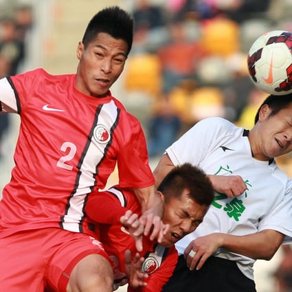 Hong Kong's Lee Chi-ho and Kwok Kin-pong battle Guangdong's Lu Lin during the first leg of the Interport Cup. Photo: Dickson Lee