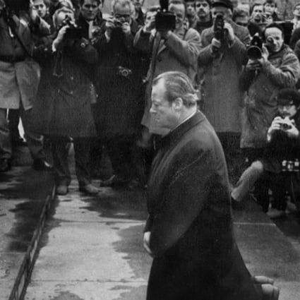 Brandt falls to his knees at a Polish monument to wartime victims. Photo: SCMP 