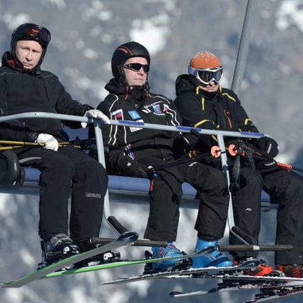 Vladimir Putin (left) with Dmitry Medvedev (centre). Photo: Reuters