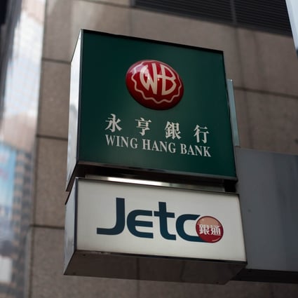 Shares in Wing Hang edged 0.17 per cent higher to close at HK$117.20 yesterday before reports of OCBC's bid. Photo: Bloomberg