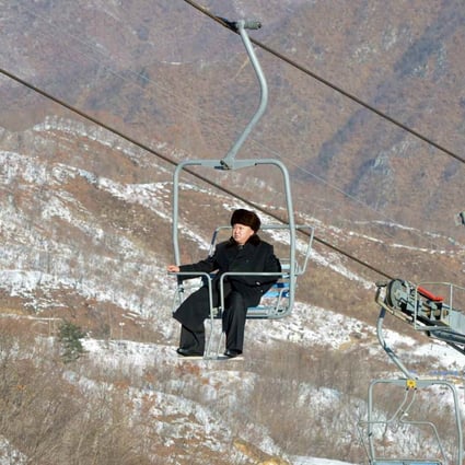 North Korean leader Kim Jong Un sits on a ski lift during a visit to a newly built ski resort in the Masik Pass region. Photo: Reuters
