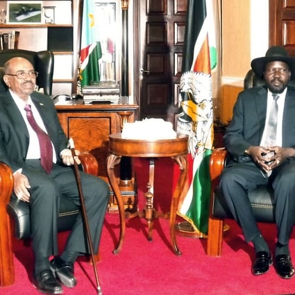 Sudan President Omar al-Bashir (left) and his South Sudan counterpart Salva Kiir pose before a meeting on Monday in Juba. Photo: AFP