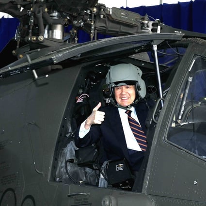 A handout photograph made available by the Taiwanese Military News Agency on 13 December 2013 shows President Ma Ying-jeou posing inside an Apache helicopter at the Kuijen Airbase in Tainan County on December 13, 2013. Photo: EPA