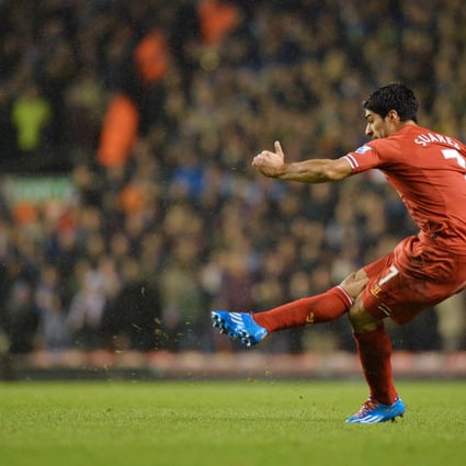 Luis Suarez takes a free-kick. Photo: AFP
