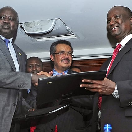 South Sudan's government-delegation leader Nhial Deng Nhial (left) and the rebel-delegation leader Taban Deng Gai (right) shake hands after signing a ceasefire agreement in Addis Ababa on Thursday. Photo: EPA