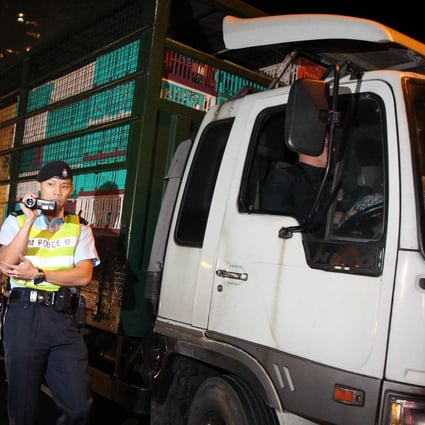 A chicken trader's truck stopped by police near Government House. Photo: Nora Tam