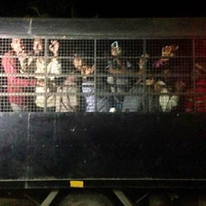 The dark side: ''Rescued'' Rohingya in Pedang Besar last night. Photo: Phuket Wan