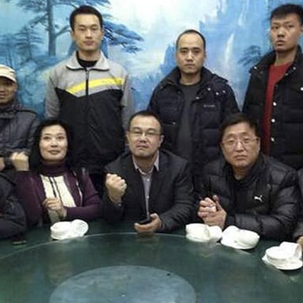 Activists convene to demand an investigation into the death of Xue Fushun, a fellow activist’s father, in Qufu on Friday. Photo: AP