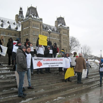 Protesters seen outside Canada's parliament in Ottawa in January demanding their permanent residency applications to be fast-tracked. Photo: AP