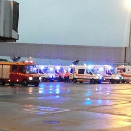 Ambulances wait for the arrival of the turbulence-hit Cathay flight at Chep Lap Kok airport. Photo: SCMP Pictures