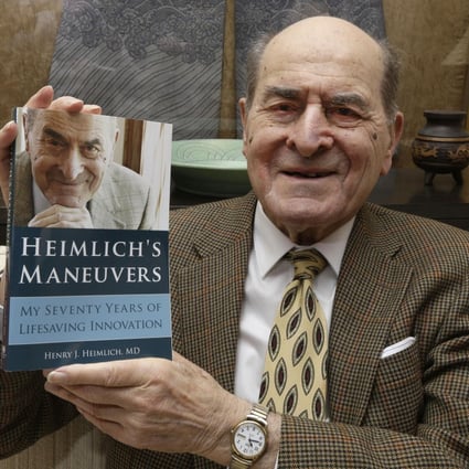 Henry Heimlich with his book. Photo: AP