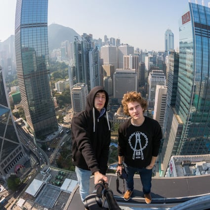 Vadim Makhorov (left) and Vitaliy Raskalov photograph themselves atop the 146-metre high Bank of America Tower earlier this year.