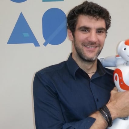 Dr Olivier Joubert with the NAO robot.