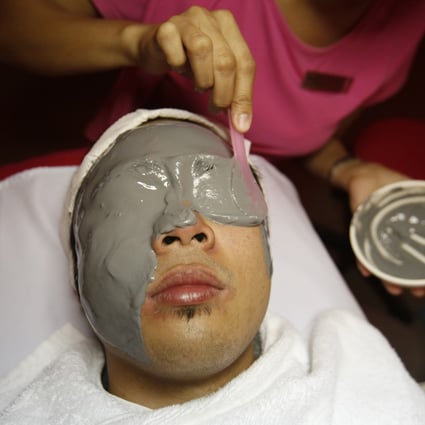 A beautician applies a mask to a male customer's face during a facial treatment at a skin care clinic in Quezon City Metro Manila . Photo: Reuters