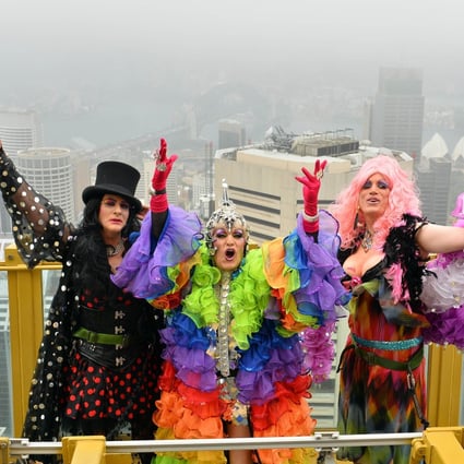 Drag Queens Dawn Service (L), Miss 3D (C) and Roma Therapy (R) pose during a photo shoot on the Observation Deck, 268 meters above street level, at the Sydney Tower Eye on February 27, 2014. Photo: AFP