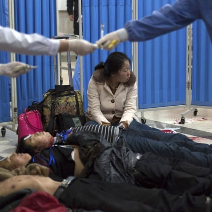 Bodies of victims lie on the floor at a hospital after a knife attack at Kunming railway station, Yunnan province. Photo: Reuters