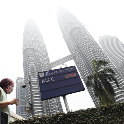 The landmark Petronas Twin Towers are lost in the haze. Photo: AP