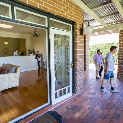 Potential buyers view a suburban house in Sydney. Price rises are partly being driven by Chinese demand. Photo: Bloomberg