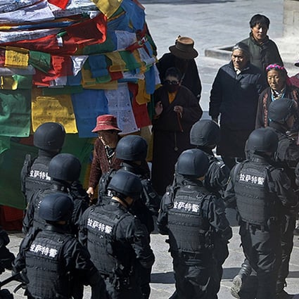 Special Weapons and Tactics police patrol outside the Jokhang monastery in Lhasa. Photo: Reuters