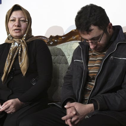 Iranian Sakineh Mohammadi Ashtiani (left) who has been sentenced to death by stoning for adultery, speaks with media in a news briefing with her son, Sajjad in Iran 2011. Photo: AP