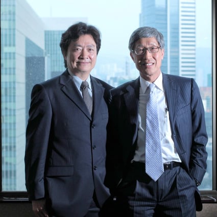 The comeback of Joseph Ling (left) and Billy Fung sparks speculation that a takeover battle for Midland may unfold. Photo: Thomas Yau