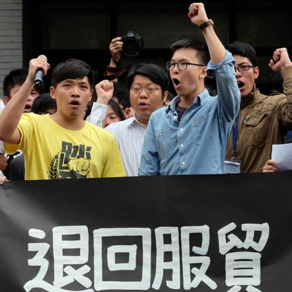 Protesters, including leader Lin Fei-fan (front right), outside Taiwan’s legislature yesterday. Photo: AFP