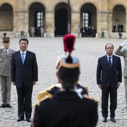 Xi Jinping and French President Francois Hollande at a ceremony in Paris. Photo: Reuters