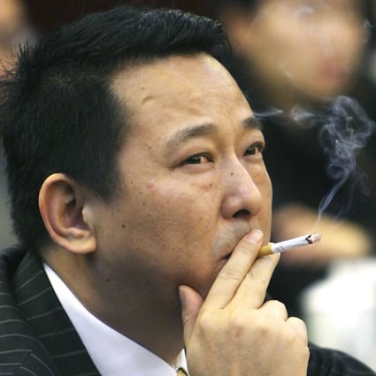 Liu Han, former chairman of Hanlong Mining, denies leading a 36-member gang on a crime spree of murder and gun-running over the past two decades. Photo: Reuters