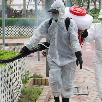 Staffs from Food and Environmental Hygiene Department use aerosol to kill mosquitos in the area around Tin Hang Estate in Tin Shui Wai, after a man was diagnosed to have been infected with Japanese Encephalitis. Photo: K. Y. Cheng