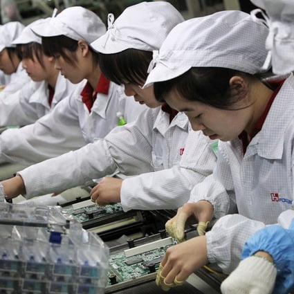 Unlike Foxconn's workers, robots don't commit suicide or demand higher wages and better working conditions. Photo: David Wong