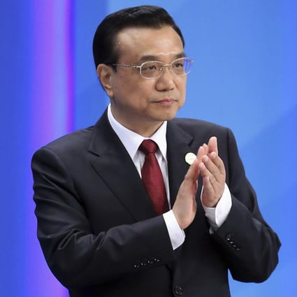 Chinese Premier Li Keqiang claps as he attends the opening ceremony of the Boao Forum for Asia Annual Conference 2014 in Boao, Hainan province April 10, 2014. Photo: Reuters 