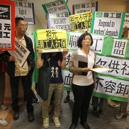 Representatives of the Hong Kong Confederation of Trade Unions and Globalisation Monitor demonstrate in support of striking workers at Yue Yuen's Tsim Sha Tsui office. Photo: Dickson Lee