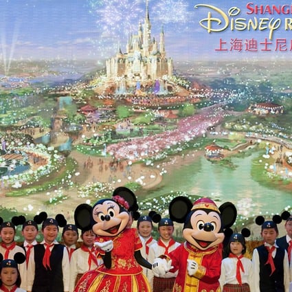 Performers dressed as Disney characters dance on stage during a groundbreaking ceremony of the world's sixth Disney amusement park in Shanghai. Photo: AP
