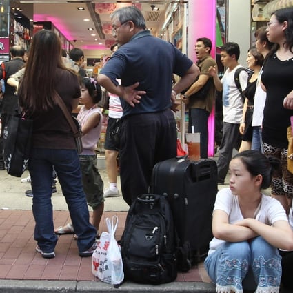 Shoppers outside a cosmetics store in Mong Kok. Photo: Felix Wong