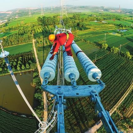 Work is progressing on a UHV power line in Zhejiang. The State Grid Corporation plans 12 such lines across China. Photo: SCMP