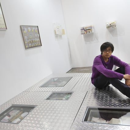 Hong Kong artist Tang Kwok-hin with his workThe Weak Are Meatat last year's Art Basel. He is returning to the show. Photo: Sam Tsang