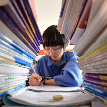 A student reviews for the national college entrance exams at a school in Hebei province. Photo: Xinhua