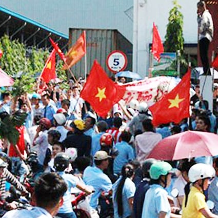 Several thousand Vietnamese workers protested at Chinese-owned factories yesterday, vandalising some of them, as anger flared at Beijing's deployment of an oil rig in the Paracel Islands. Photo: SCMP Pictures