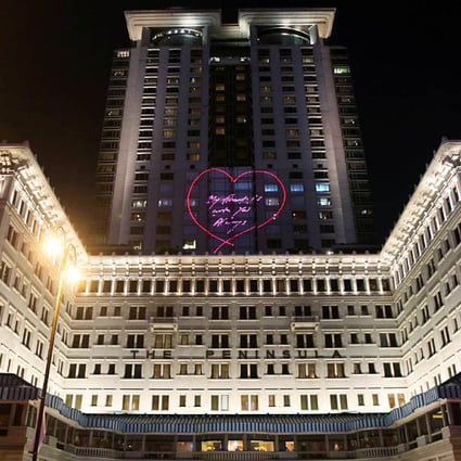 British artist Tracy Emin’s neon piece ‘My Heart Is With You Always’ is projected onto the Peninsula Hotel on May 15. Photo: Edward Wong