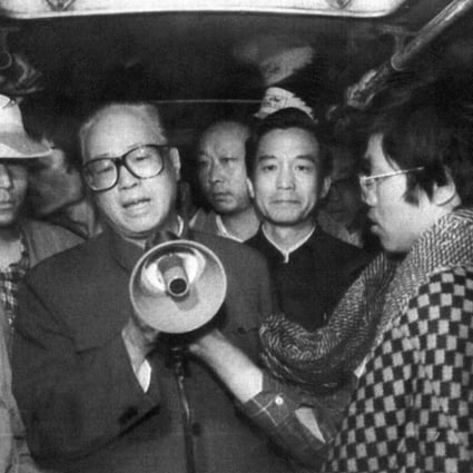 Zhao Ziyang, then the Communist Party chief, addresses student hunger strikers with a loud-hailer in Tiananmen Square at dawn on May 19, 1989, inside a bus where they were sheltering. He tearfully told them: "We have come too late." Photo: AFP
