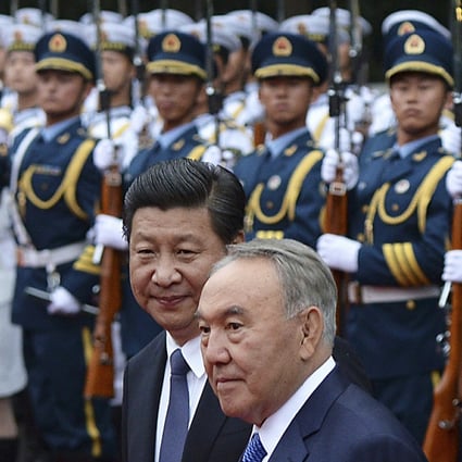 China's President Xi Jinping (left) and Kazakhstan's President Nursultan Nazarbayev look on next to an honour guard during a welcoming ceremony at the eve of the fourth Conference on Interaction and Confidence Building Measures in Asia (CICA) summit, in Shanghai. Photo: Reuters