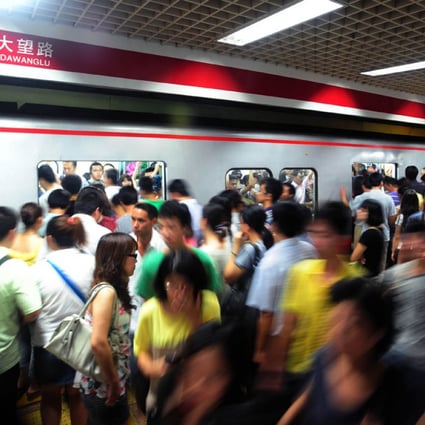Busy platform during the rush hour in a Beijing underground station. 